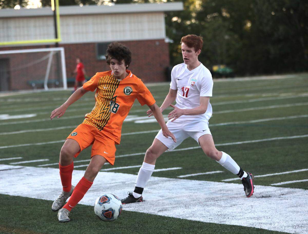Catawba Ridge’s Caden Tull dribbles the ball as A.C. Flora’s William Hamilton tries to stop him Friday in Fort Mill