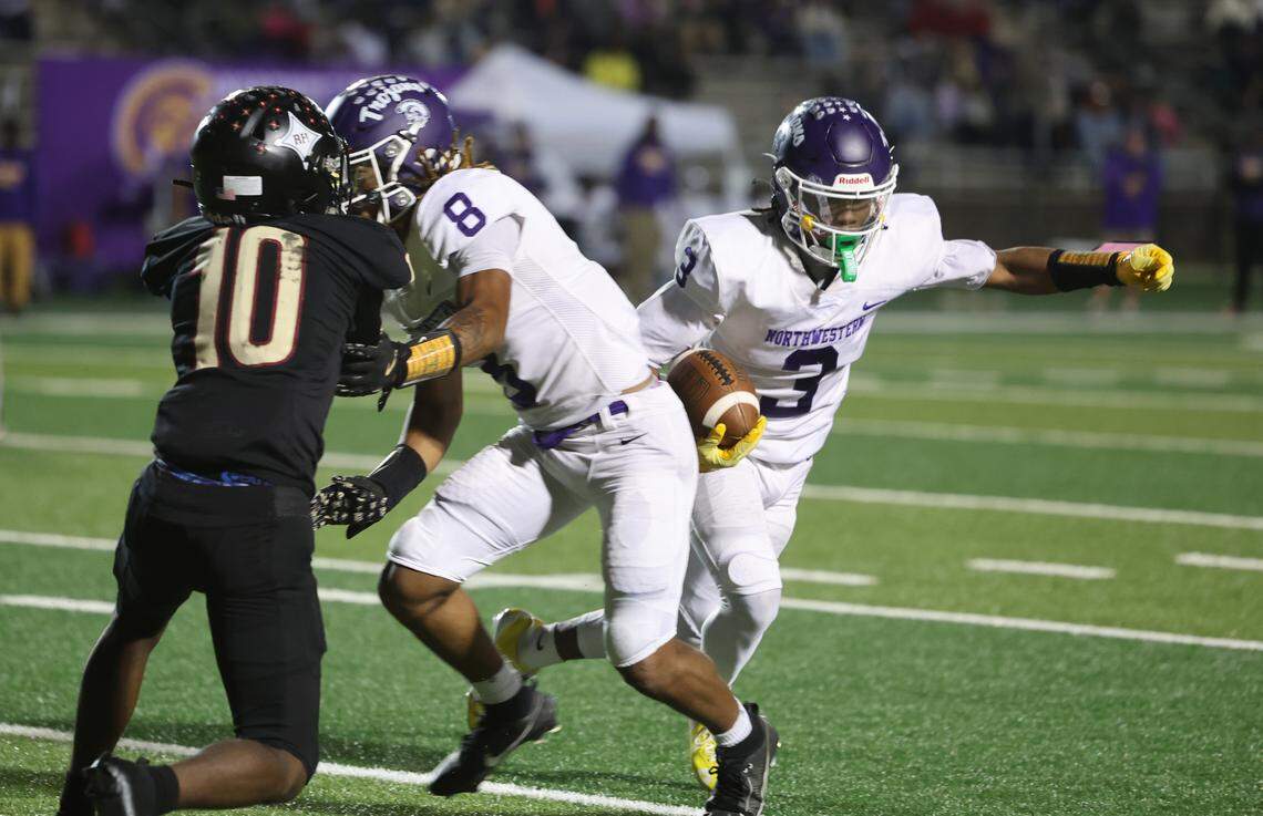 Northwestern's Kameron Vance takes the ball around Northwestern's Jonathan Spurgeon (8) and Rock Hill's Miles Durant Friday, Oct. 17, 2025 in Rock Hill, S.C.
