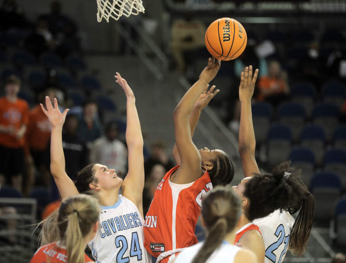 Andrew Jackson’s Tamia Watkins shoots over Christ Church’s McCall King.