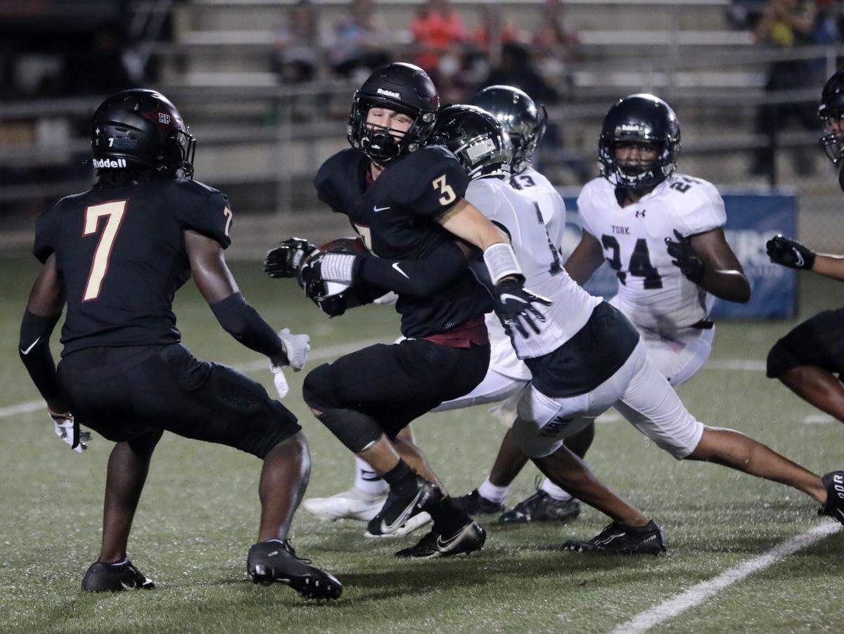 Rock Hill’s Nathan Bruce is brought down by York’s Amarion Huskey-Thompson.