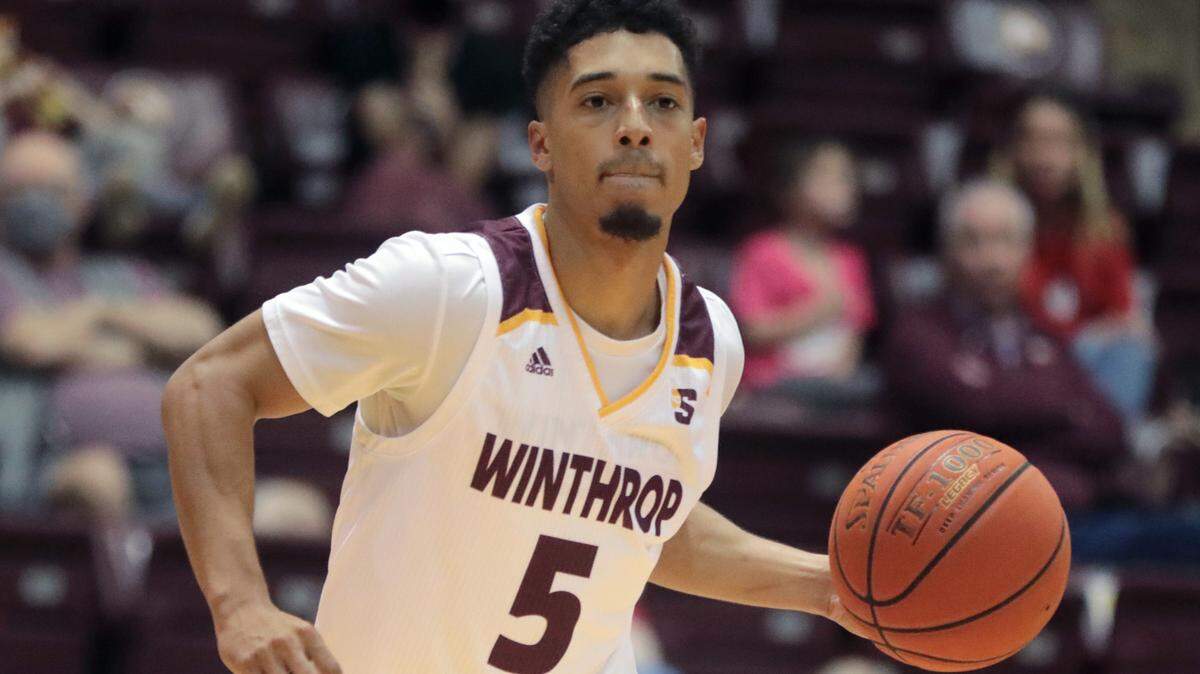 Winthrop’s Patrick Good heads up the court.