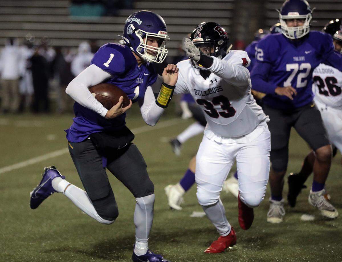 Boiling Springs’ Joston Miller (33) tries to bring down Northwestern’s Will Mattison (1).
