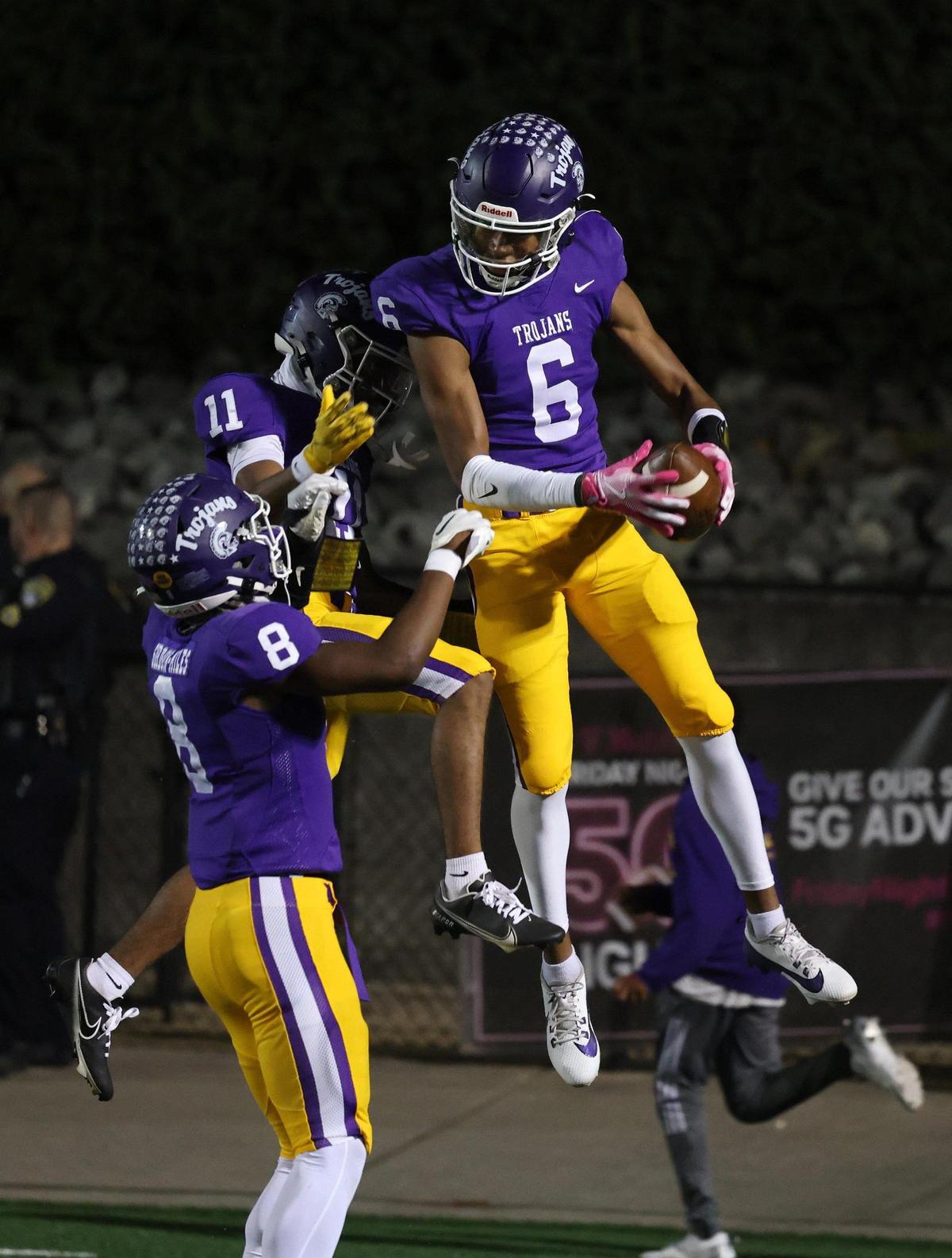 Northwestern’s Daniel Caldwell (6) celebrates with Evan Harrison (11) and Zymier Gordon-Miles Friday, Oct. 18, 2024 in Rock Hill, S.C.
