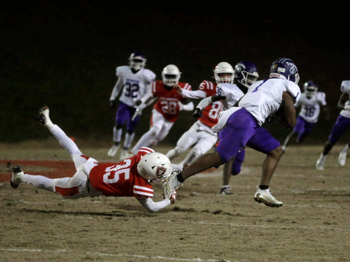 Northwestern’s Turbo Richard (1) carries the ball Friday during the Class 4A Upperstate Championship against Greenville High School in Greenville, S.C.