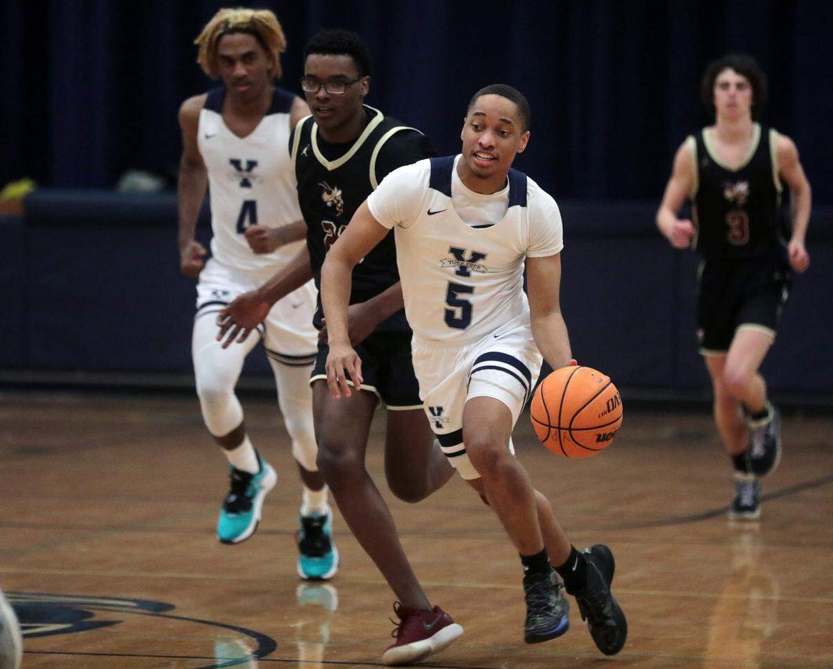 York Prep’s Ladarian McCree dribbles up the court to the basket.