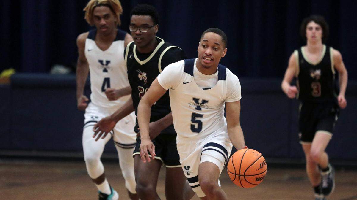 York Prep’s Ladarian McCree dribbles up the court to the basket.