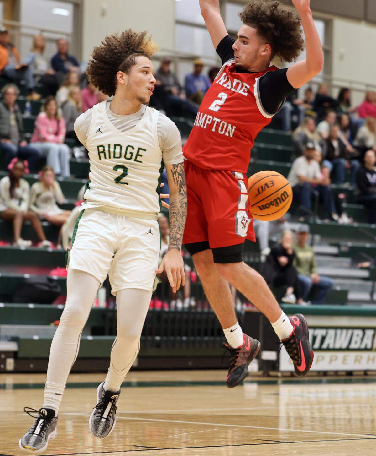 Catawba Ridge’s Zyan Hager and Wade Hampton’s K.J. Banks miss the ball