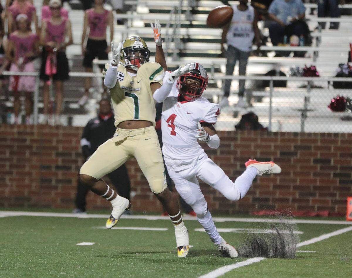 Catawba Ridge’s Jacobie Henderson (7) tries to catch the ball as South Pointe’s Chris Mccullough attempts to intercept it during the first half of the game Friday (Oct. 1) in Fort Mill.