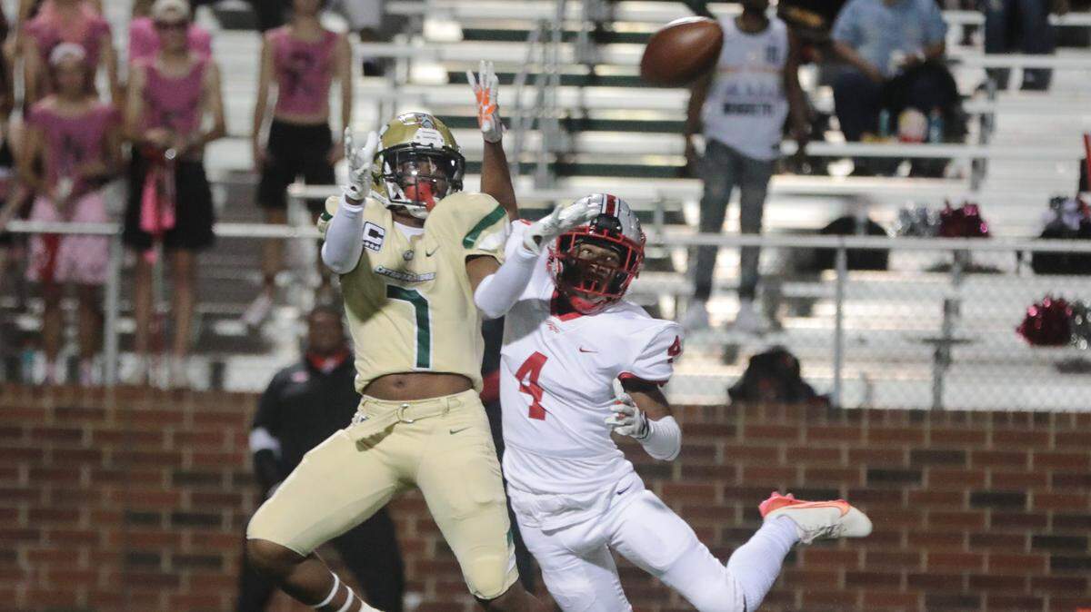 Catawba Ridge’s Jacobie Henderson (7) tries to catch the ball as South Pointe’s Chris Mccullough attempts to intercept it during the first half of the game Friday in Fort Mill.