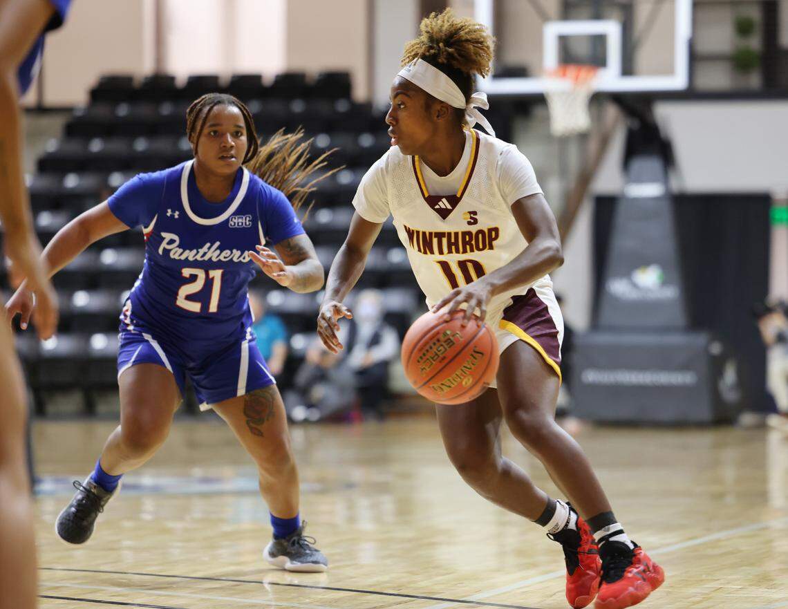 Winthrop’s Jada Ryce dribbles past Georgia State’s Erin Turral Thursday at the Rock Hill Sports and Event Center.