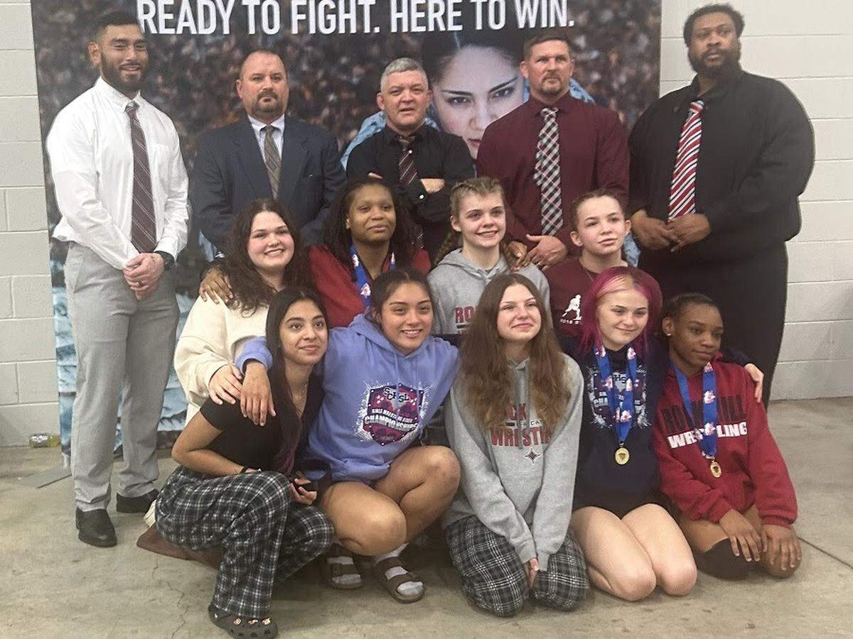 Madilyn Beck (front row, second from right) and Sirenity Davis (front row, far right) won individual girls wrestling state titles. Brismar Velazquez (front row, second from left) qualified for state while Alyciah Thomas (second row, second from left) finished as individual state runner-up.