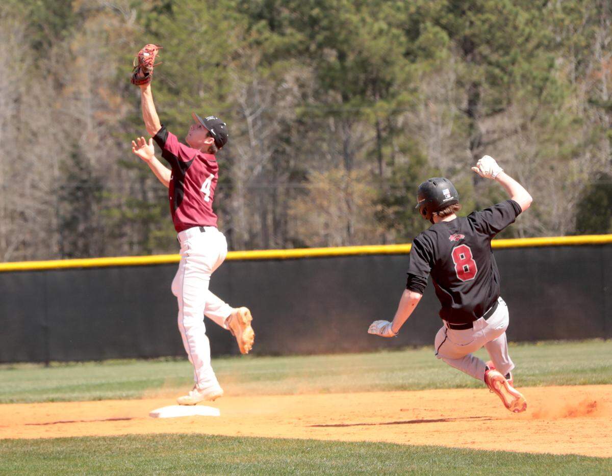 Rock Hill’s Coleman Van Sickle catches the ball as South Pointe’s Nolan Faulkenberry slides into base Tuesday in York.