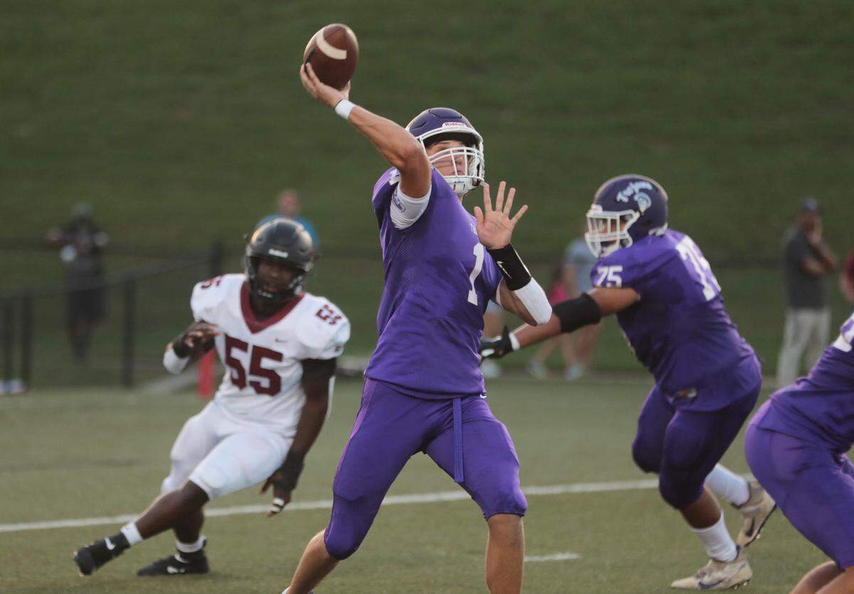 Northwestern’s Will Mattison throws the ball downfield as the Trojans take on the Rock Hill Bearcats in varsity football earlier this season.