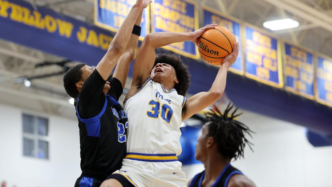 Fort Mill’s Logan Parker (30) shoots over Indian Land’s Brent Michael Terrell Thursday in Fort Mill.