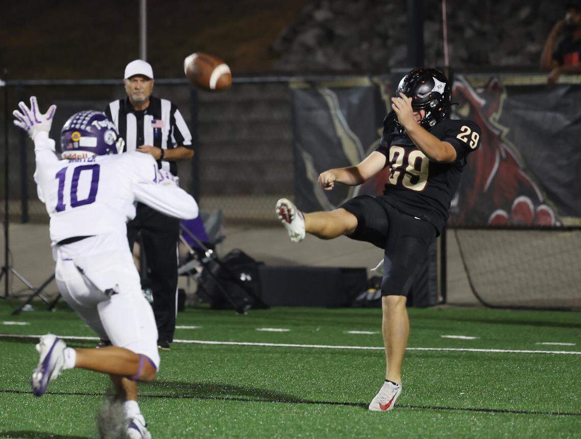 Rock Hill's Jackson Grant punts the ball as Northwestern's Jayden Baxter tries to block it Friday, Oct. 17, 2025 in Rock Hill, S.C.