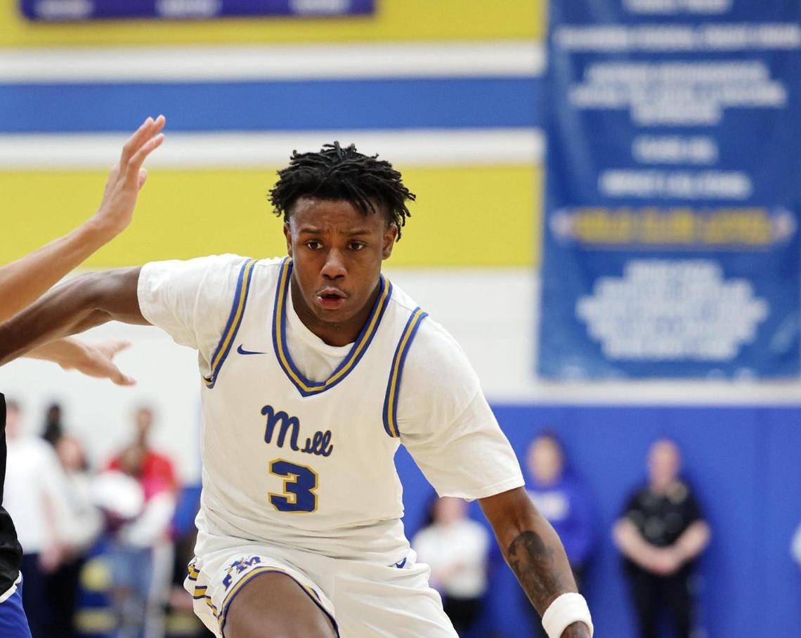 Fort Mill’s Nas Berry dribbles around Indian Land’s Donovin Jones Wednesday in Fort Mill.