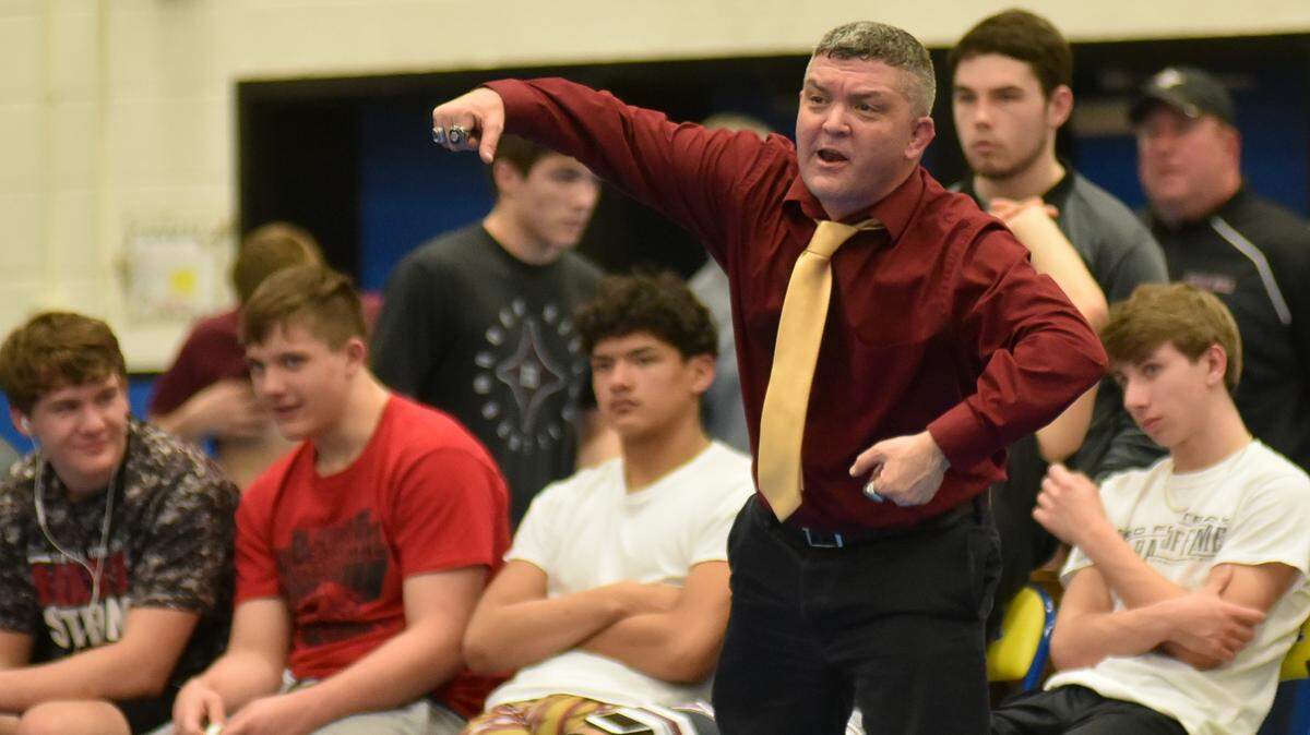 Rock Hill head coach Cain Beard watches from the sideline as 5A wrestling titans Fort Mill and Rock Hill clashed in 2019. Beard has done a lot to try to grow the sport of wrestling in the Rock Hill area.