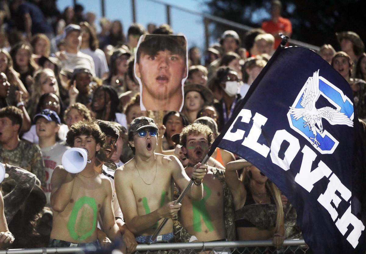 Clover High School fans cheer during the first half of the game against Northwestern