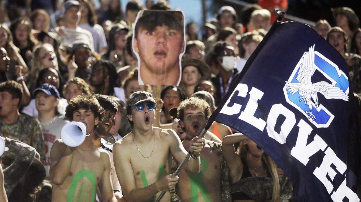 Clover High School fans cheer during the first half of the game against Northwestern