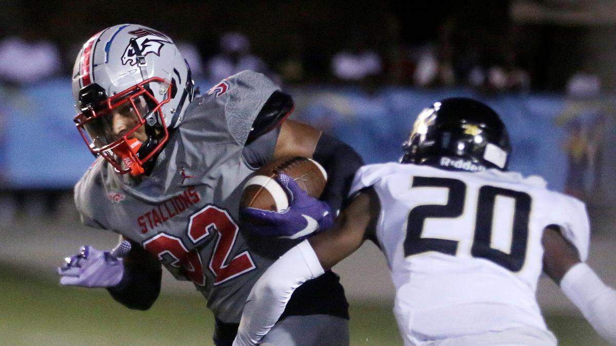 South Pointe’s Derrick “DJ” Barksdale II (32) carries the ball against Gaffney’s King Dowdle (20).