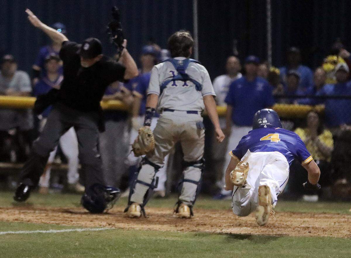Fort Mill’s Eli Craddock dives into home plate