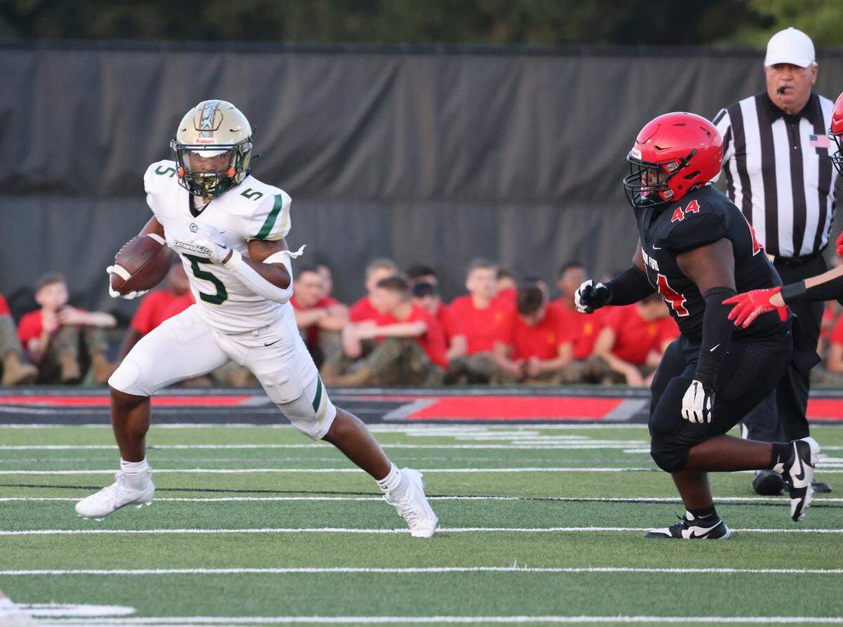 Catawba Ridge’s Ira Mister carries the ball against Nation Ford’s Zyon Neely