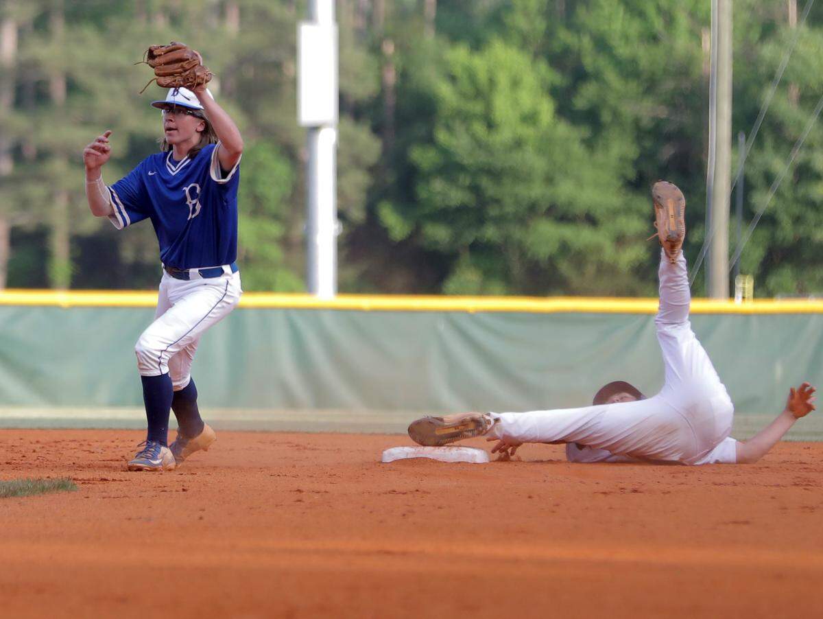 Northwestern’s Owen Sarna tries to slide into second, but is tagged Thursday in Rock Hill.