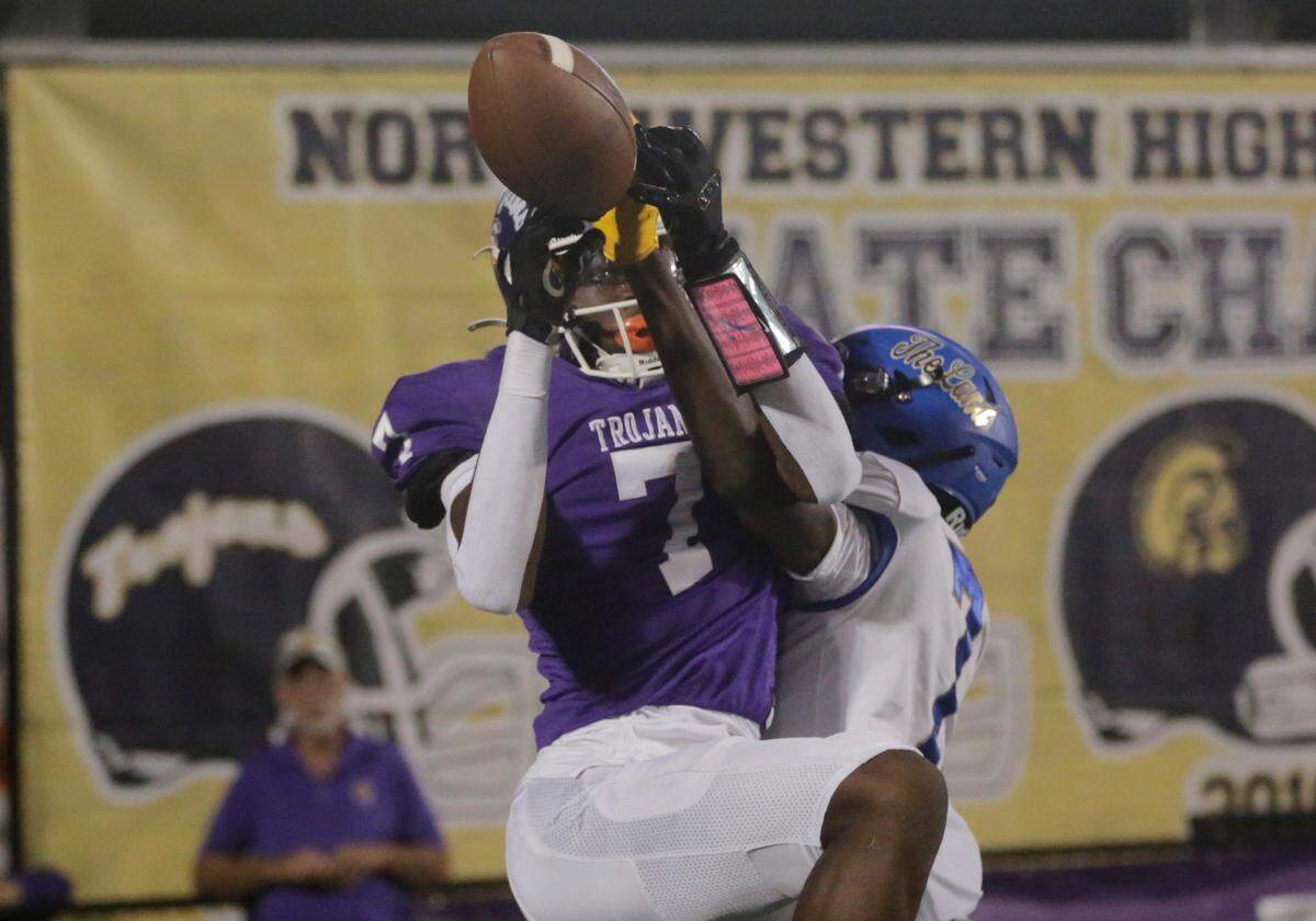 Northwestern’s TaDarrian Knox, left, and Indian Land’s Camdin Portis fight for the ball in the endzone