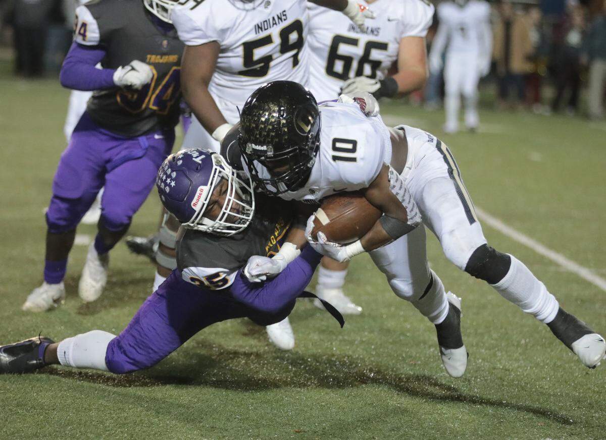 Northwestern’s D.J. Jackson, left, tackles Gaffney’s Tyler Smith.