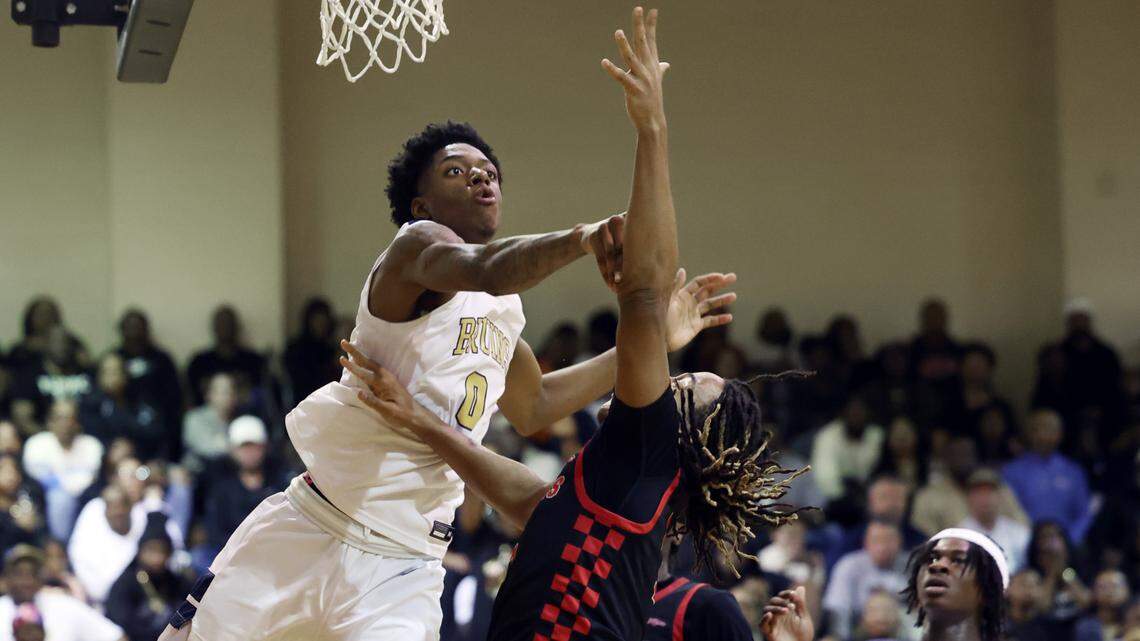 Lancaster’s Jordan Watford blocks South Pointe player Caymen Finch’s shot Tuesday in Lancaster.