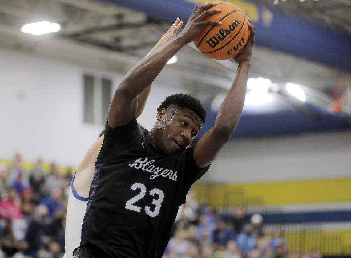 Ridgeview’s Gregory Jackson II gets the rebound Monday as the Yellow Jackets take on the Ridgeview High School Blazers in Fort Mill.