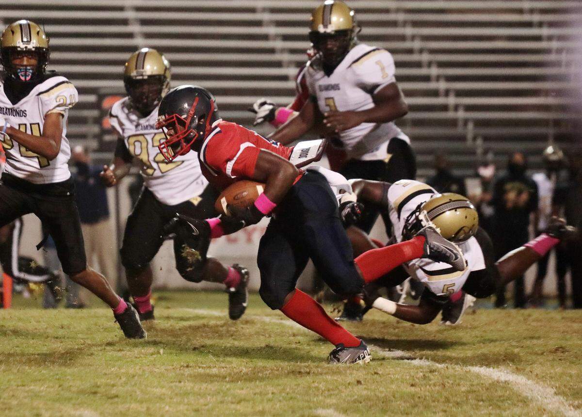 Chester’s Jaden Simmons is brought down Wednesday as the Chester Cyclones take on the Lower Richland Diamond Hornets.