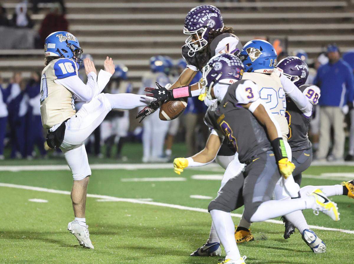Northwestern’s Tamarion Watkins (1) blocks a punt by Indian Land’s Connor Frew Friday, Nov. 22, 2024 in Rock Hill, S.C.
