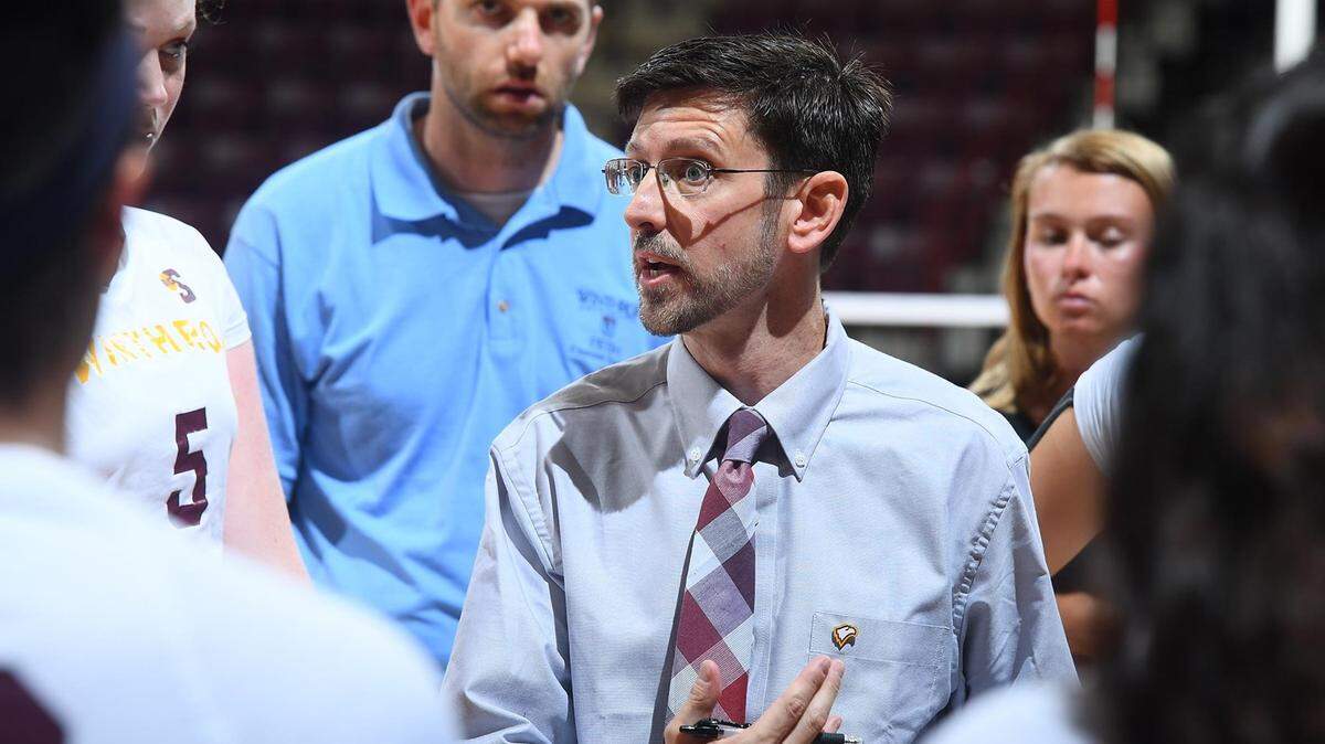Chuck Rey coaches a volleyball game in the Winthrop Coliseum. He was promoted to athletic director in June 2022.