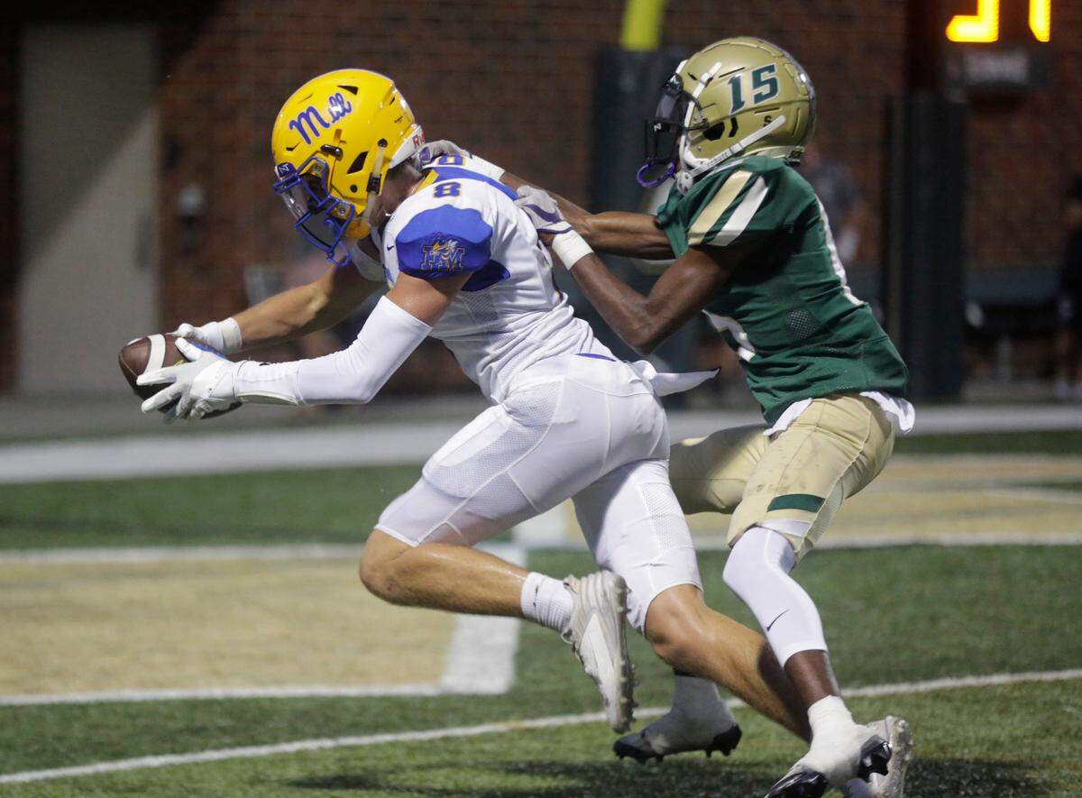 Catawba Ridge’s Darius Sutton (15) tries to stop Fort Mill’s Tanner Mays from scoring a touchdown Friday, Aug. 18, 2023.