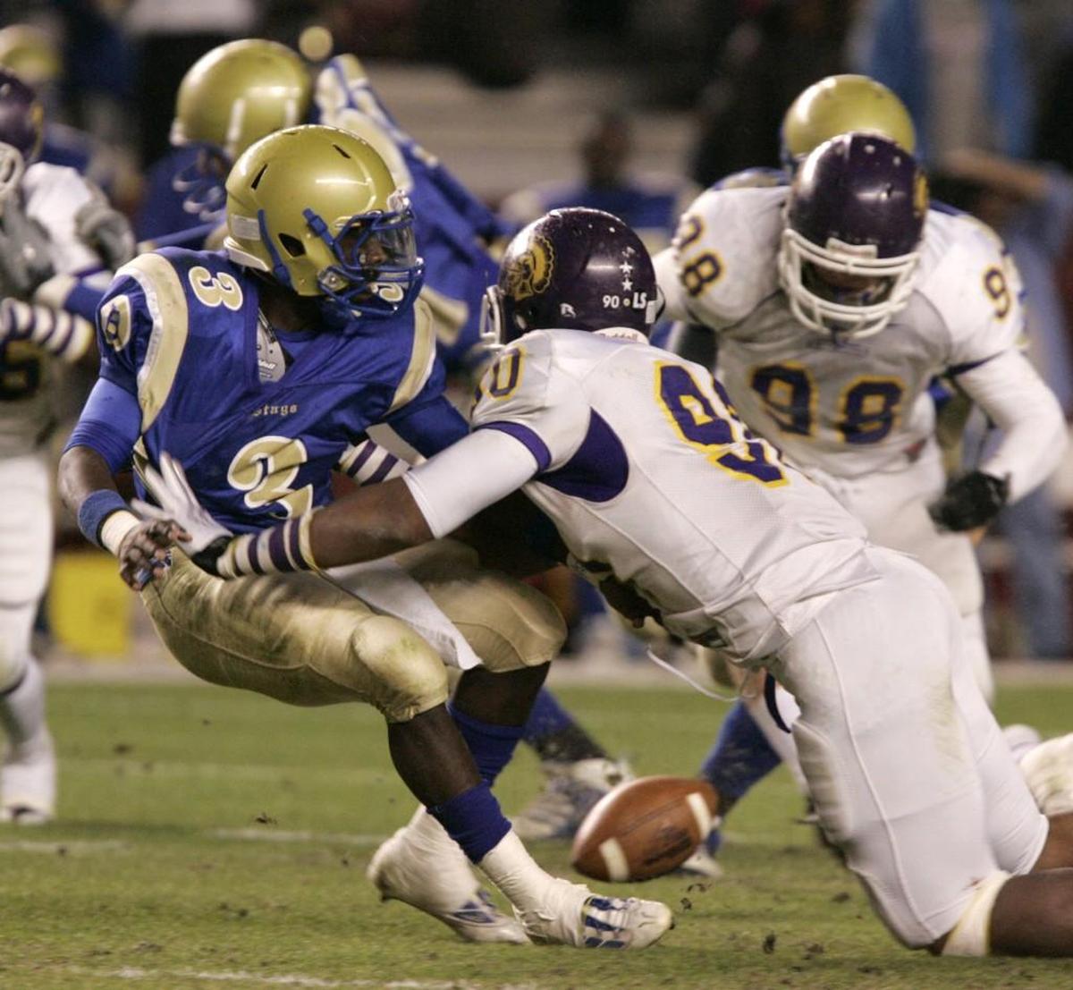 Herald file (2009): Northwestern’s Roderick Byers forces a Berkeley player to fumble in 2009. Byers was a crucial part of the state championship team in 2010.
