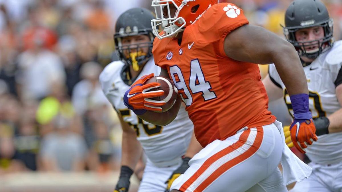 
Clemson tackle Carlos Watkins returns an interception for a touchdown in the first half of Saturday’s game against Appalachian State. Clemson won 41-10. 
