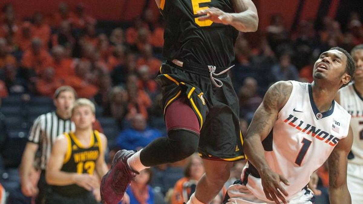 Winthrop guard Keon Johnson (5) flips up a shot past Illinois guard Jaylon Tate (1) during an overtime of an NCAA college basketball game in Champaign, Ill., on Monday, Nov. 21, 2016.