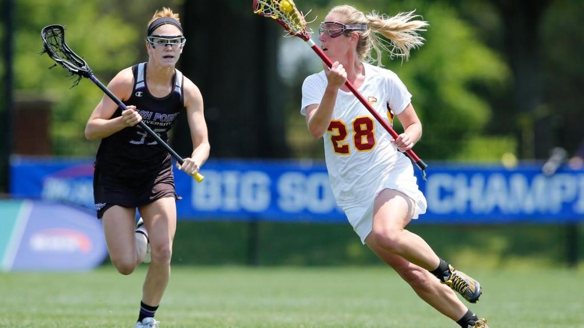 Winthrop's Paige Jenkins drives down the field as Winthrop defeats High Point for the Big South Women's Lacrosse Championship