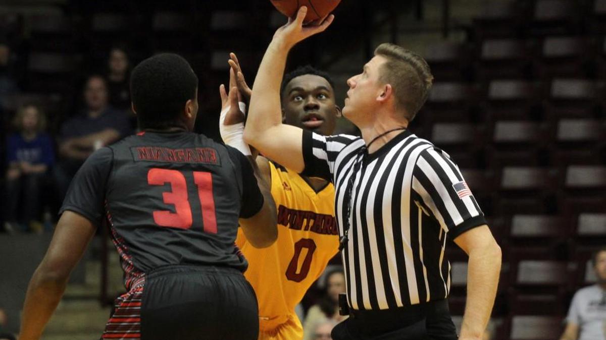 Winthrop's Duby Okeke and Gardner-Webb's L'Hassane Niangane get set to jump for the opening tip Saturday at the Winthrop Coliseum.