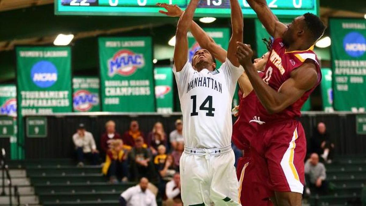 Winthrop’s Duby Okeke and Xavier Cooks challenge a Manhattan shot at the rim Tuesday morning.