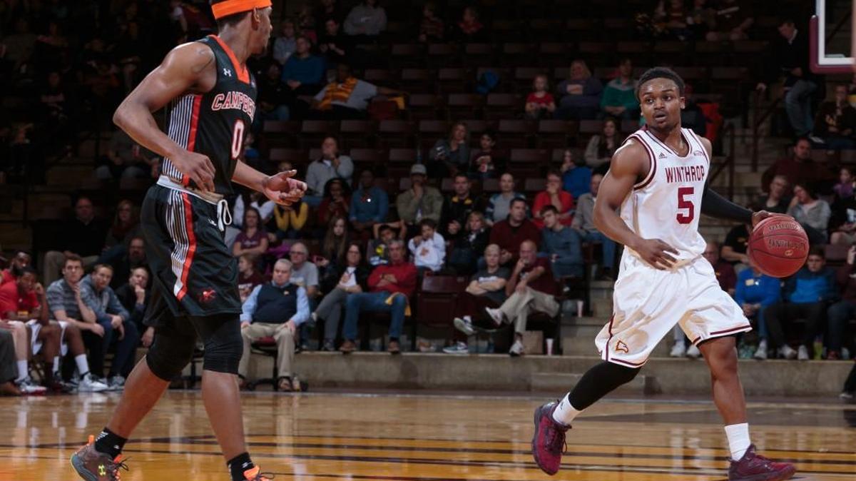 Winthrop's No. 5 Keon Johnson brings the ball down court against Campbell's No. 0 Kyre Hamer as Winthrop hosts Campbell in Big South Conference play Saturday 2-4-2017.