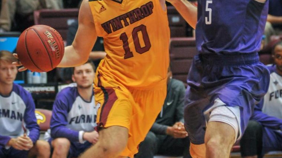 Winthrop's Anders Broman drives the baseline during first half action Wednesday at Winthrop Coliseum. Broman later drained a 3-pointer in the final seconds of overtime to lift the Eagles to 58-57 win over Furman.