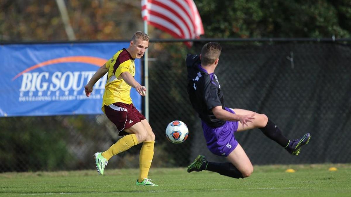 Tournament MVP Max Habenstab goes for a ball near a High Point defender on Sunday in the Big South Men’s Soccer Championship in High Point, N.C. Habenstab had the winning penalty kick in Winthrop’s victory.
