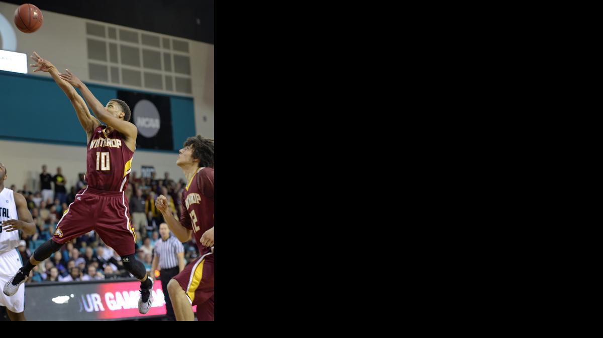 
Winthrop’s Keon Moore shoots a jumper during the first half of the Big South Conference Championship NCAA college basketball game against Coastal Carolina, Sunday in Conway.
