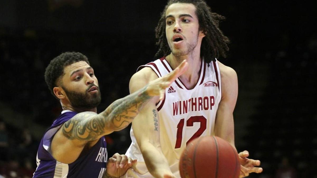 Winthrop's Xavier Cooks looks for an opening around High Point's Tarique Thompson. Cooks had 19 points and nine rebounds, but Winthrop fell to its first loss in 2017.