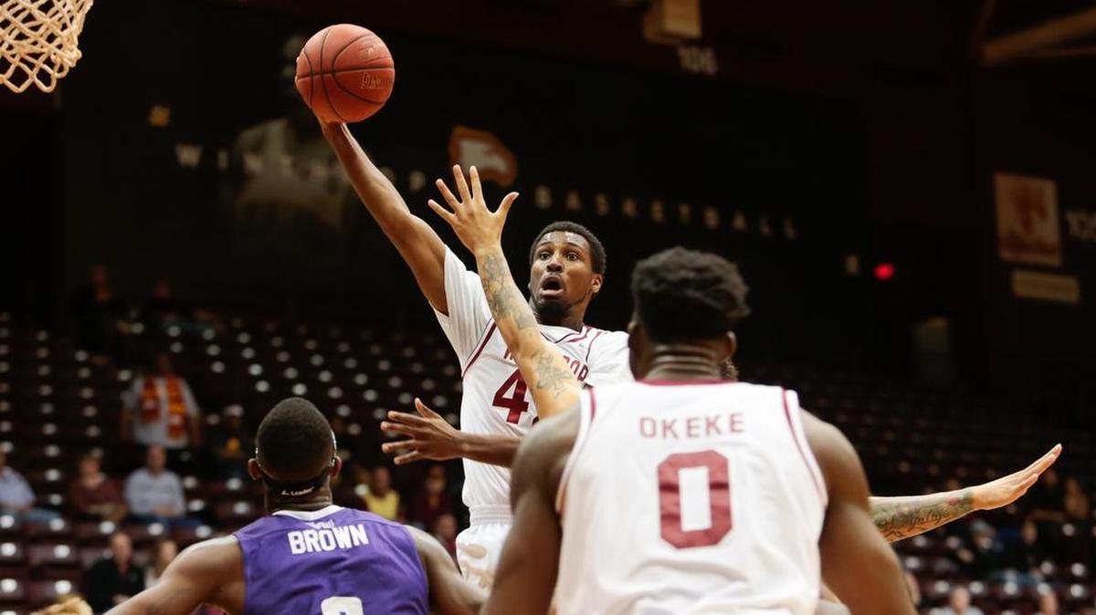 Winthrop's No. 42 Joshua Davenport heads to the basket as Winthrop hosts High Point in Big South basketball, 1-14-2016.