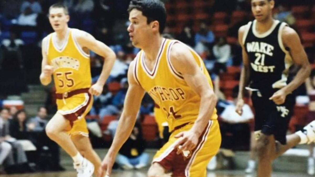 A young Tim Duncan (right) chases Winthrop guard Mike Fayed during a Feb. 4, 1995 college basketball game in Rock Hill.