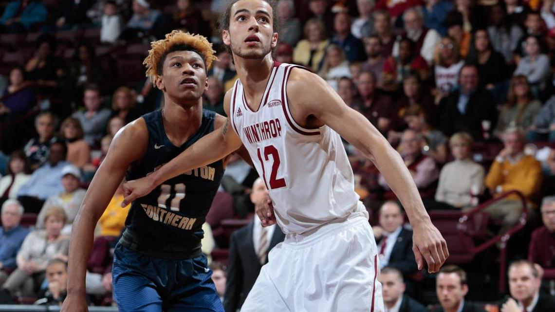 Winthrop's Xavier Cooks (12) gets position on Charleston Sothern's Christian Keeling (11) for the rebound as top-seed Winthrop takes on eighth-seed Charleston Southern on Thursday in the quarter final round of the Big South Tournament.