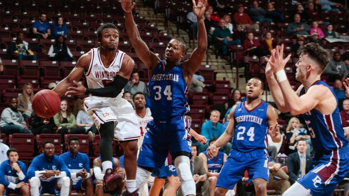 Winthrop's Keon Johnson makes a pass under the basket as Winthrop University hosts Presbyterian College in Big South Conference basketball.